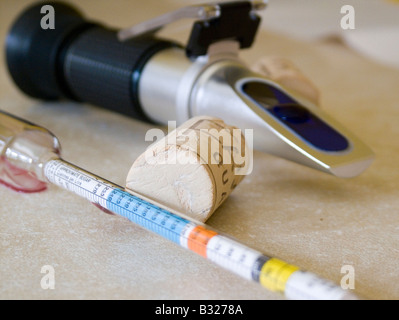 Home wine making with a hydrometer and a refractometer Stock Photo