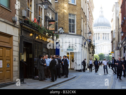 Watling Street City of London, office workers socialising after work. St Paul's Cathedral in background Stock Photo