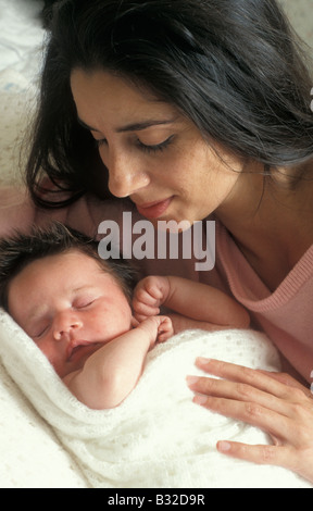 anglo asian mother bonding with her newborn baby Stock Photo