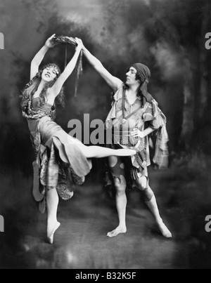 Male and female ballet dancers performing in costume Stock Photo