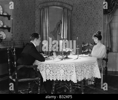 Couple having formal dinner at home Stock Photo