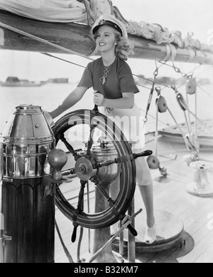 Portrait of woman steering boat Stock Photo