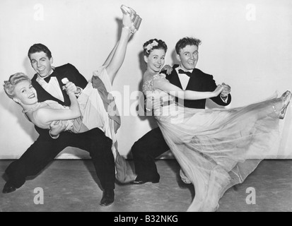 Portrait of two couples dancing Stock Photo