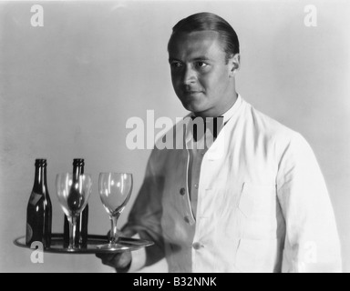 Waiter with beverages on tray Stock Photo