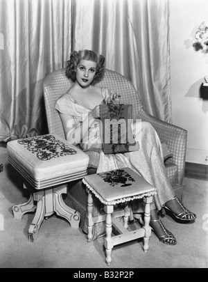 Portrait of woman embroidering Stock Photo