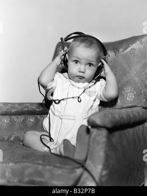 Portrait of baby wearing headphones Stock Photo