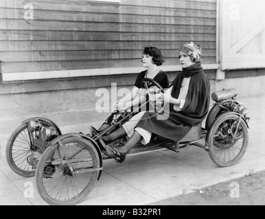 Two women in go kart Stock Photo