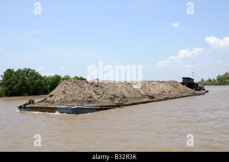 Sand dredging barge on the Mekong River Vietnam Stock Photo