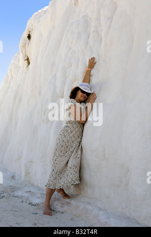 Woman posing at calcite terraces and sulphur water pools at Pamukalle Turkey Stock Photo