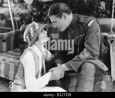 Young man holding a young woman's hands Stock Photo