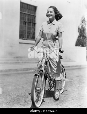 Young woman riding her bike