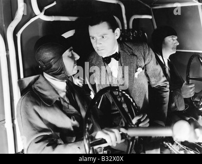 Three men inside of the cockpit of an airplane Stock Photo