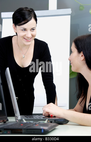 Women in the office under discussion Stock Photo