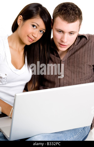 A young couple using a computer together Stock Photo