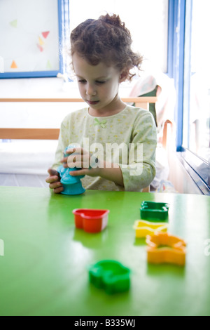 Five Year Old Girl Suffering from PDD in Occupational Therapy Stock Photo