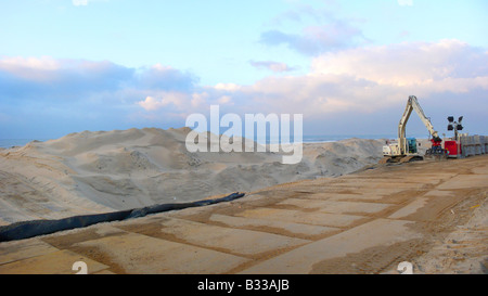 dike construction for amplifying the coast Stock Photo