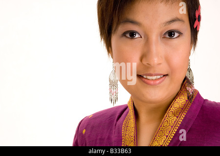 An asian girl wearing a traditional silk jacket Stock Photo