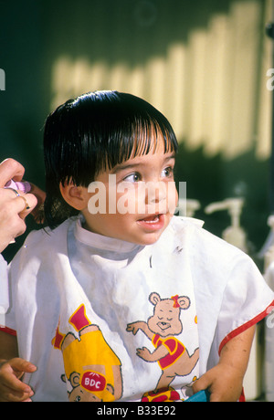 Hispanic toddler boy first haircut. Stock Photo