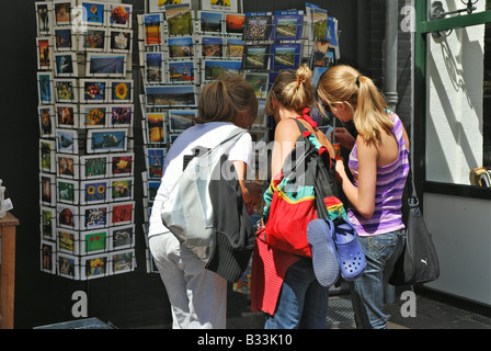 tourists choosing postcard from a shop display in Holland Stock Photo