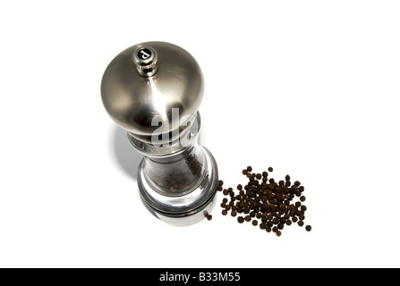 Pepper grinder with loose peppercorns Stock Photo