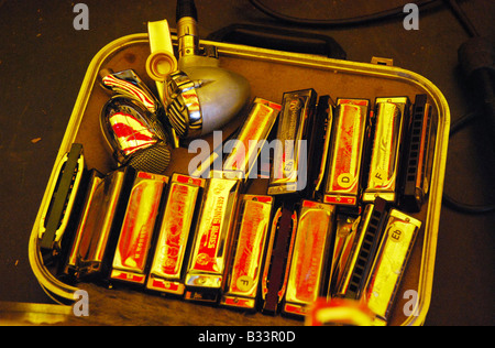 harmonica case and microphone on stage Stock Photo