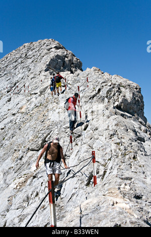 Climbers on Koncheto ridge near Bansko in World Heritage Site Pirin National Park Bulgaria Stock Photo