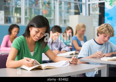 Students studying in geography class Stock Photo