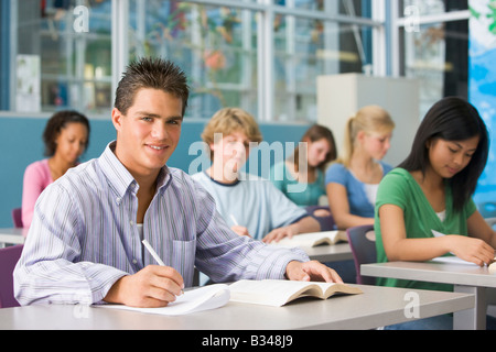 Students studying in geography class Stock Photo