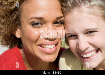 Two young women posing outdoors Stock Photo