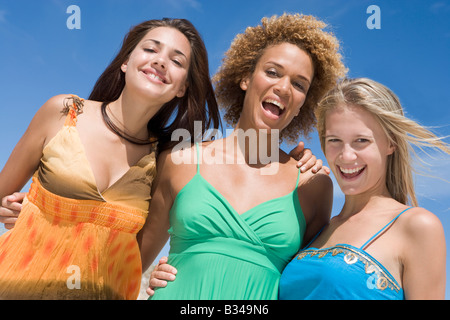 Three women posing outdoors Stock Photo