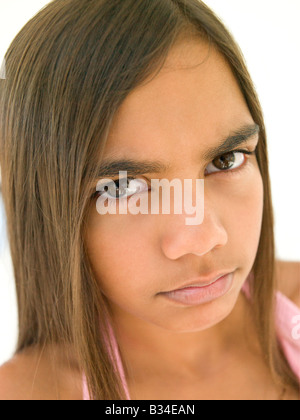 Young girl frowning Stock Photo