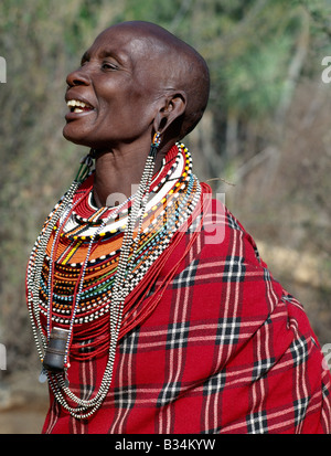 Kenya, Samburu district, Kirimun. A Samburu woman singing.  The strings of black and white beads hanging from her ears signify t Stock Photo