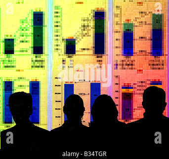 sales staff studying projection of chart showing financial report Stock Photo