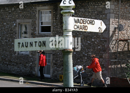 Old signpost for Taunton, Wadeford and Chard in the village of Combe St. Nicholas, Somerset. Stock Photo