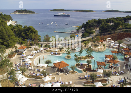 Amfora Hvar Grand Beach Resort, hotel pool area overlooking offshore islands in Adriatic Stock Photo