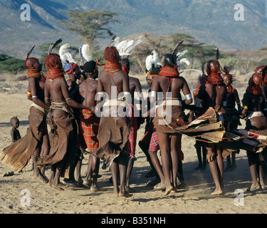 Kenya, South Horr Valley, South Horr. Song is an art form ingrained in Turkana culture. After months of separation, young men and girls gather together during the rains when grass is abundant and life is relatively easy for a while. The Turkana have a rich repertoire of at least twenty dances, most of which are quite energetic. Stock Photo