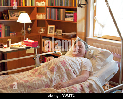 ELDERLY BEDRIDDEN MAN AT HOME Stock Photo