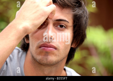Young Man Itching Forehead Model Released