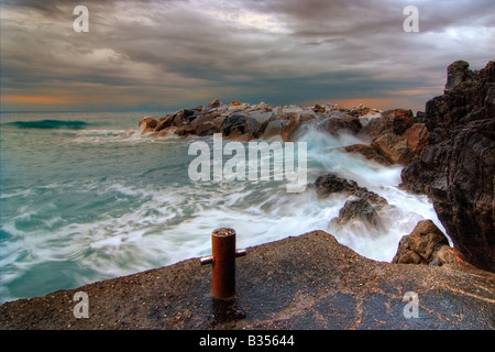 A small harbour along the coast near to Riomaggiore, Cinque Terre. Taken a early morning on January during a strong wind storm Stock Photo