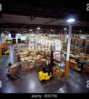Forklifts in distribution facility of restaurant supply company Stock Photo
