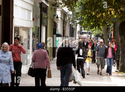 Shoppers walk down the Promenade in  Cheltenham Gloucestershire Stock Photo