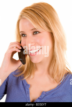 A beautiful smiling girl is talking to her cellphone Stock Photo