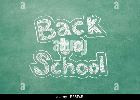 Old chalkboard with the phrase Back to school written on it Stock Photo