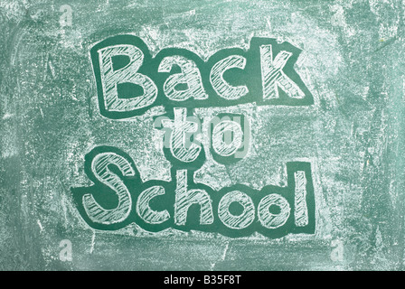 Old chalkboard with Back to school written on it Stock Photo