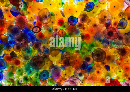 Glass blown sculptures adorn the ceiling in the Bellagio casino lobby in Las Vegas Nevada Stock Photo