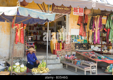 A lady runs her daily market stall in Vietnam Stock Photo
