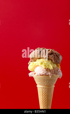 ICE CREAM CONE ON RED BACKGROUND Stock Photo