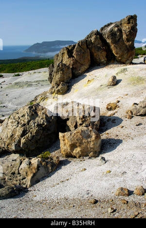 Plateau fumarole and volcanic bomb on volcano Mendeleev, Kunashir island, Kurils islands, Far East of Russia Stock Photo