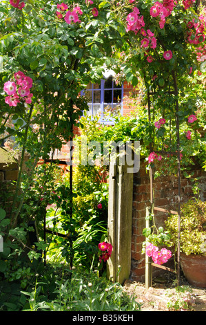 Traditional Rose Arch in a country garden England July Stock Photo