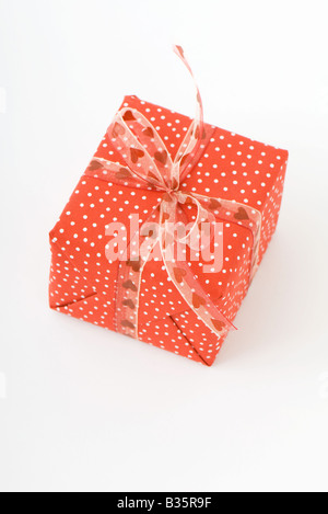 Wrapped gift, red and white polka dots Stock Photo